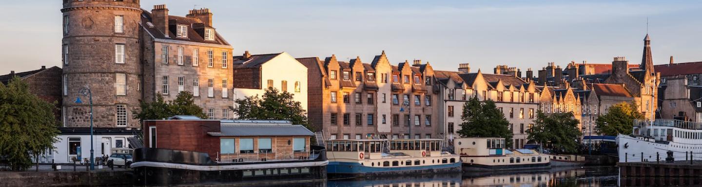 Buildings in Edinburgh reflected on a body of water