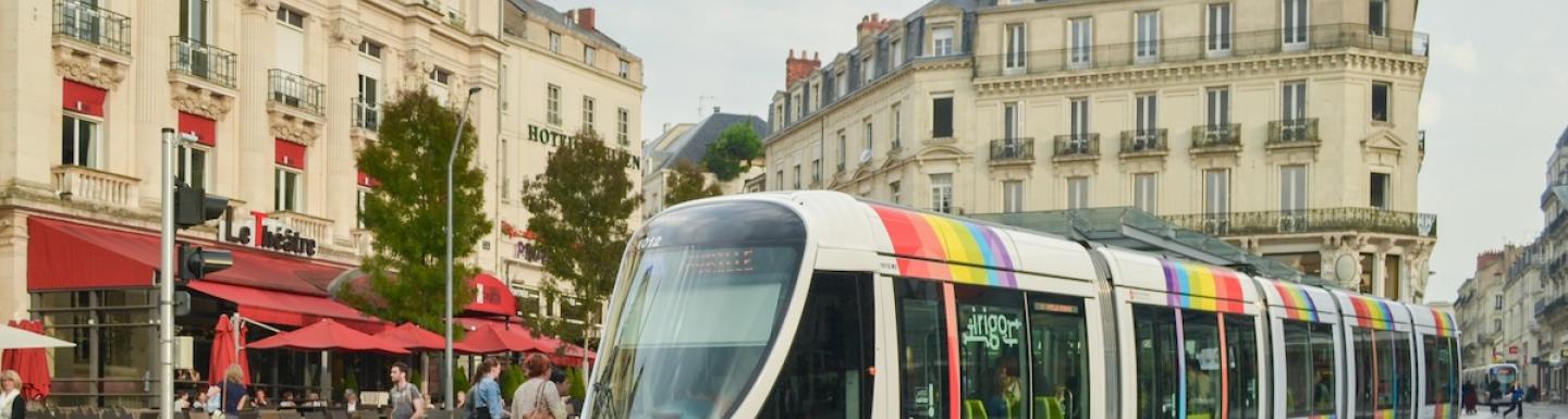 City tram with a rainbow flag emblem of LGBT in Angers, France.