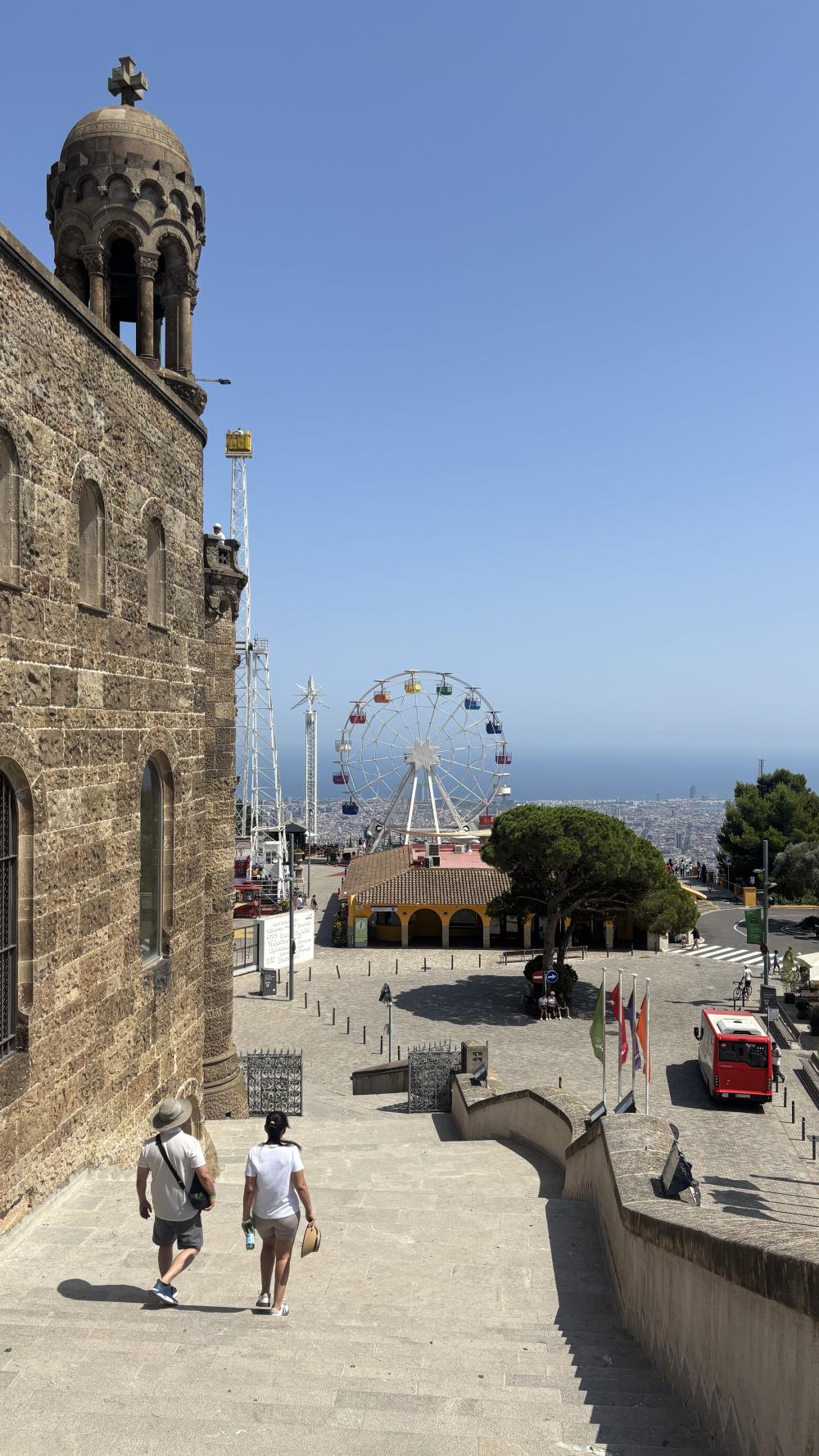 A view of a church and ferris wheel in Barcelona