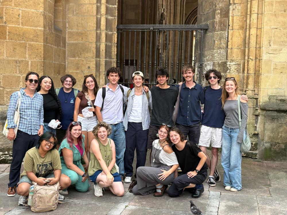 Group of students posing in front of a building