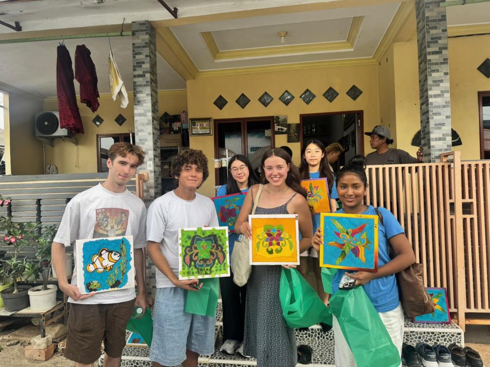 A group of uo students holding an art project