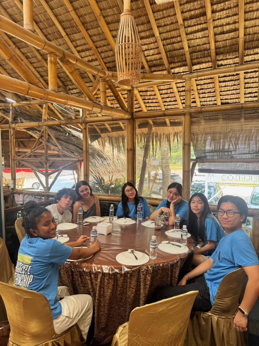 A group of students sitting around a table