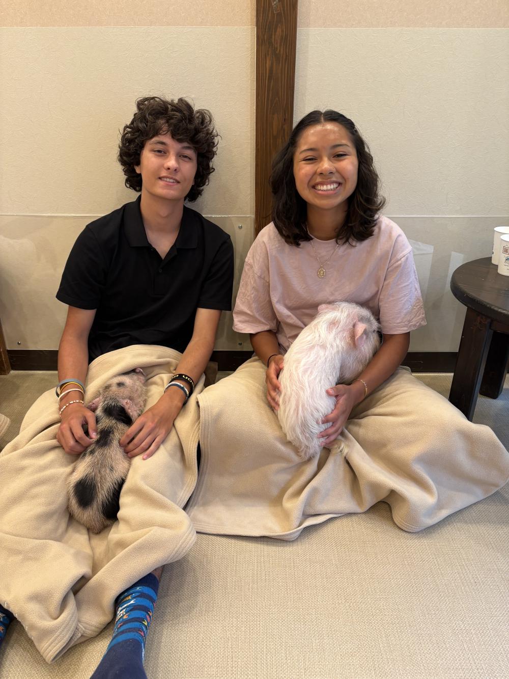 Two uo student in a pig cafe
