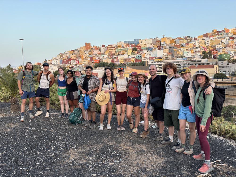 a group of people with cityscape behind
