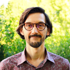 Headshot male beard and glasses