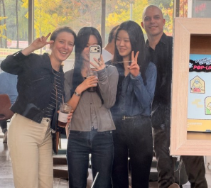 Four people posing for a selfie