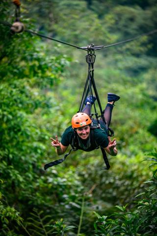 student ziplining in costa rica