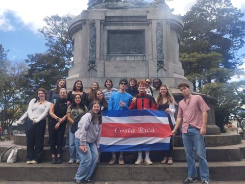 group of students stand with a Costa Rica flag