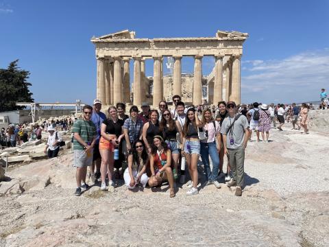 Group of students in front of Greek ruins
