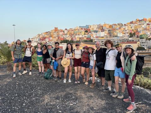 a group of people with cityscape behind