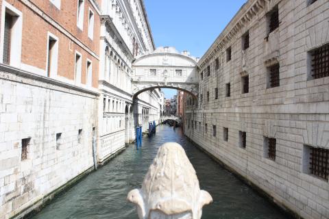 View of a canal with tall buildings on each side