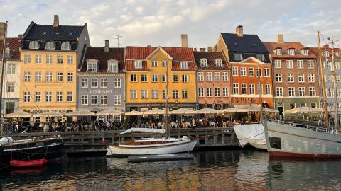 Line of colorful buildings in Copenhagen along the waterfront.