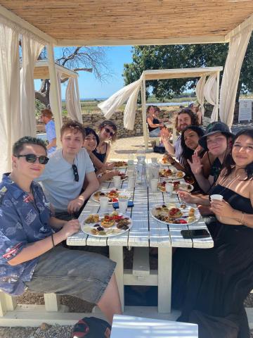 group of friends eating lunch in Italy
