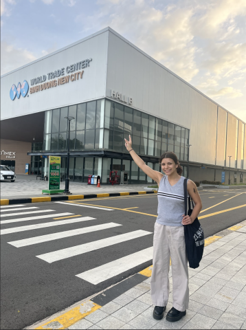 College student pointing to the World Trade Center in Binh Duong New City, Vietnam. 