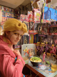 Elizabeth in cosplay as character Giorno Giovanna at a Jojo’s Bizarre Adventure themed ramen place in Osaka. They often cosplay characters as part of their drag persona. October 31, 2023.