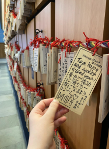 An Ema (絵馬), small wooden tablets or plaques on which people write wishes or prayers to the gods and leave them at a shrine or temple, I left at Haneda Airport, wishing for a bright future. October 2025. 