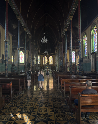inside a church, the lighting is dark