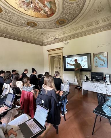 A group of UO students sitting in a classroom during a lecture in a classroom in the Siena GEO center