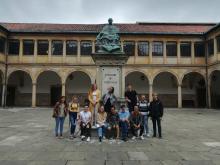 Students standing in front of statue in Oviedo 