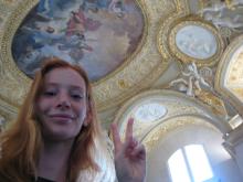 Student Emma Egbert posing in front of a painted ceiling in Madrid