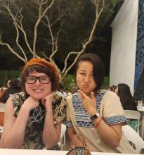 Two young women sitting at a table