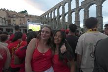 Two young women stand together in Segovia, Spain