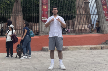 College male posing in front of a cathedral. 