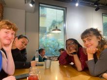 Four students sitting at a dinner table in Spain