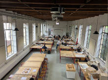 Aerial view of students in an architecture classroom working on models