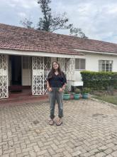 Sadie standing outside of a building in Kisumu, Kenya