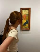 A girl looking at art