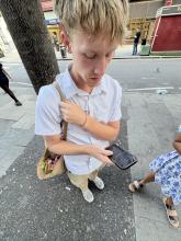 A student navigating on his phone