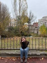 Bailey smiling sitting down in a garden in Spain during the winter