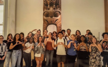 Cohort of GEO students throwing their "O" in the British Museum