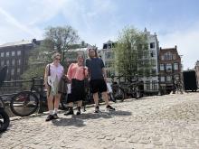 A group of uo students standing on a bridge in Amsterdam