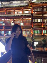 a uo student posing in front of Chinese temple 