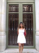 A uo student posing outside an apartment in Barcelona