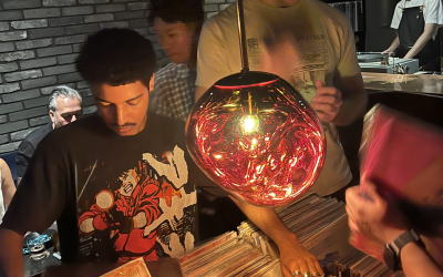 A young man sorts through records in a Japanese record store