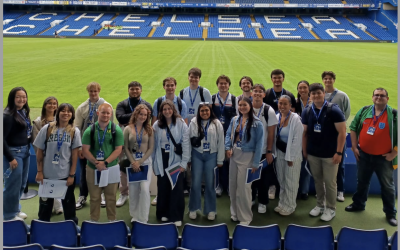 Group of college students in Stamford Bridge stadium