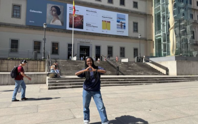 Ariel standing outdoors in front of Reina Sofia, an art museum in Madrid