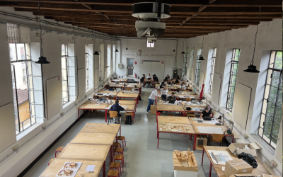 Aerial view of students in an architecture classroom working on models