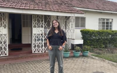 Sadie standing outside of a building in Kisumu, Kenya