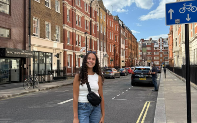 Girl standing in the middle of the street in London. 