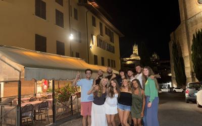Luke and 10 friends outside in Siena at night
