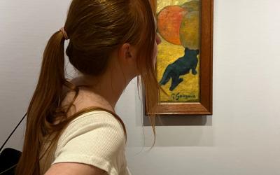 A girl looking at art