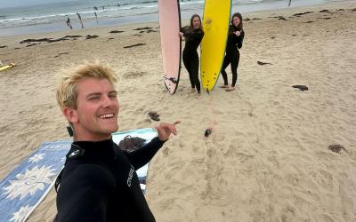 Calvin surfing with friends on Philip Island