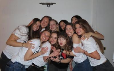 Cohort of students smiling for a photo in Siena