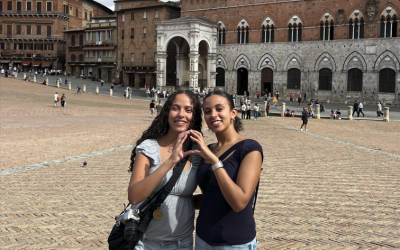 Two Students standing in a plaza